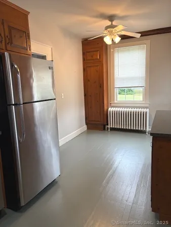 a view of a room with wooden floor and staircase
