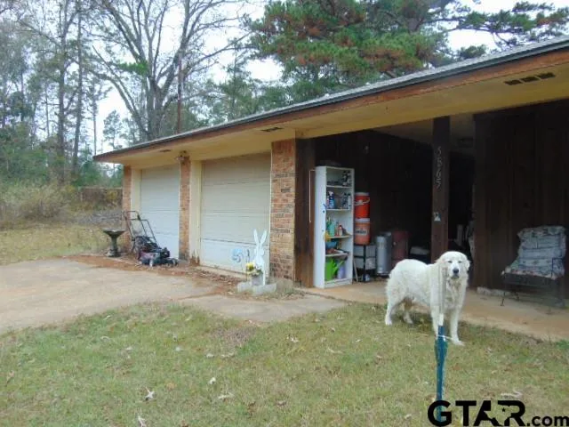 a brick house with a yard