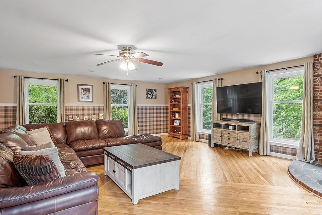 237 Hollis Road Lunenburg, MA 01462 - Photo 17 of 42 a living room with furniture and a flat screen tv
