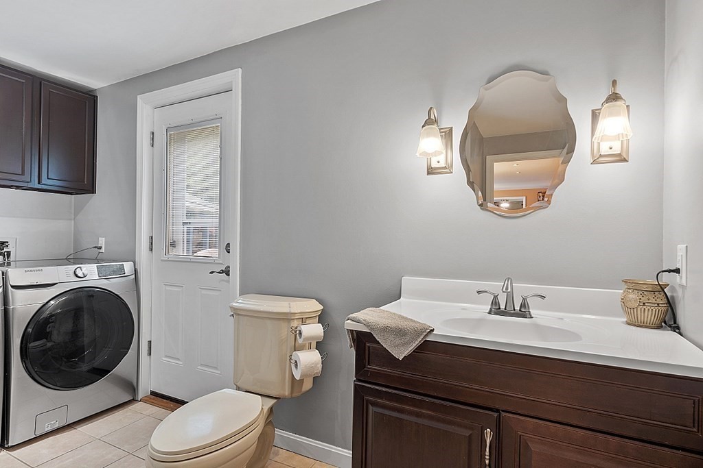 237 Hollis Road Lunenburg, MA 01462 - Photo 18 of 42 a bathroom with a sink mirror and toilet