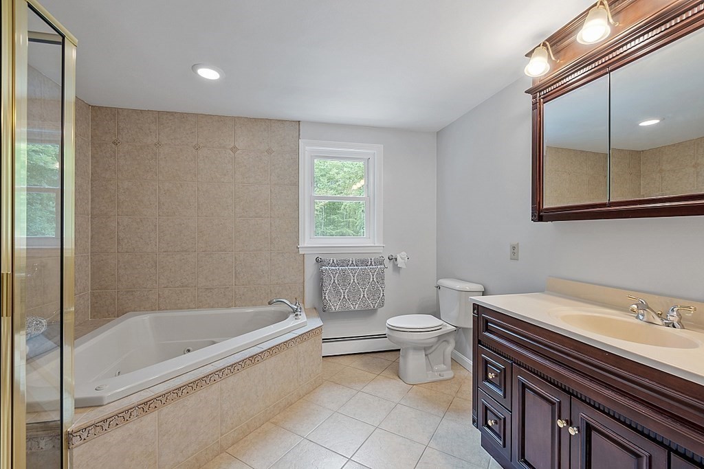 237 Hollis Road Lunenburg, MA 01462 - Photo 21 of 42 a bathroom with a sink a toilet and bathtub