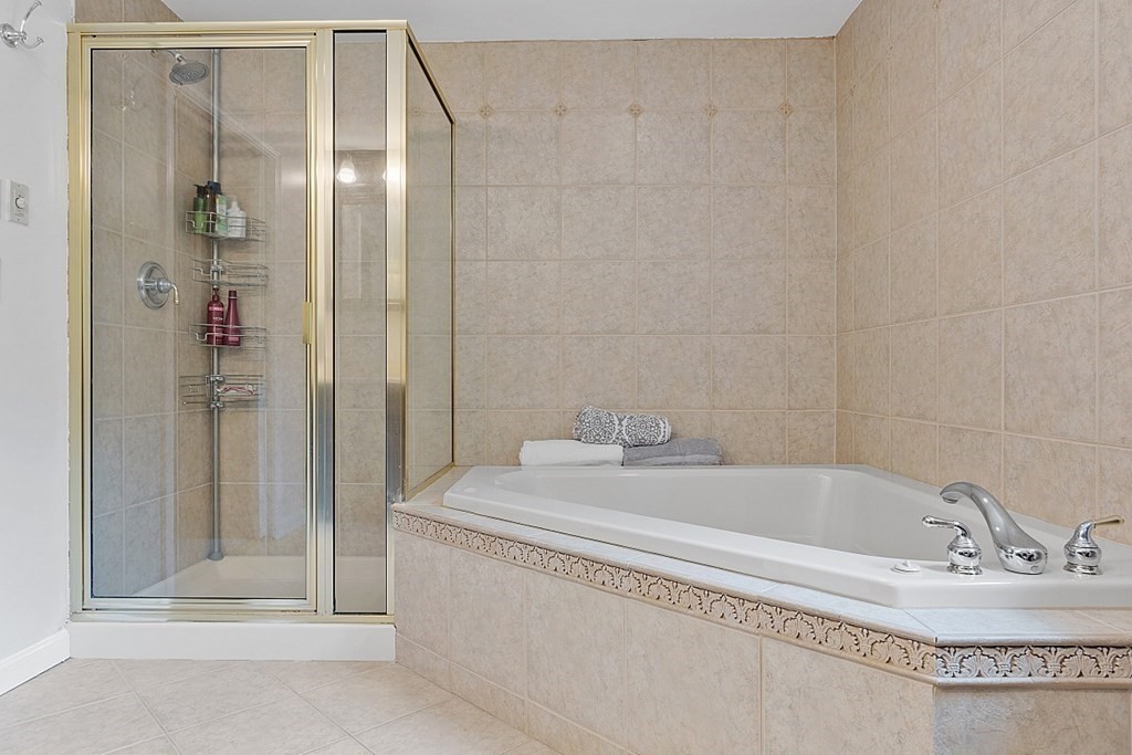 237 Hollis Road Lunenburg, MA 01462 - Photo 22 of 42 a bathroom with a tub and shower