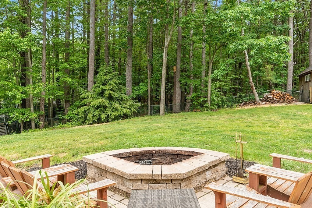 237 Hollis Road Lunenburg, MA 01462 - Photo 30 of 42 a backyard of a house with yard and outdoor seating