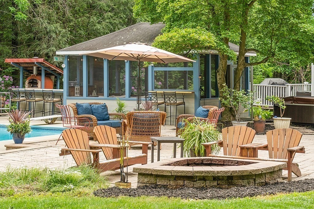 237 Hollis Road Lunenburg, MA 01462 - Photo 31 of 42 a view of a house with backyard outdoor seating area and furniture