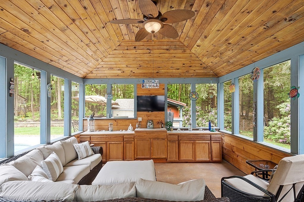237 Hollis Road Lunenburg, MA 01462 - Photo 32 of 42 a living room with furniture and large windows