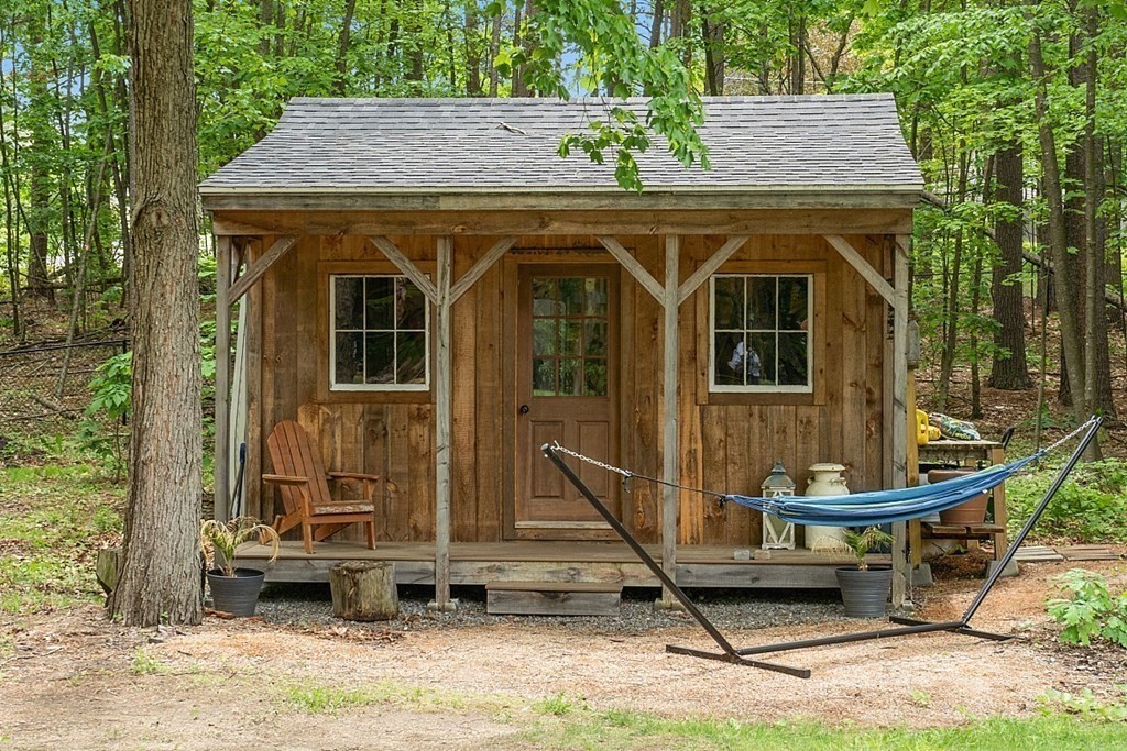 237 Hollis Road Lunenburg, MA 01462 - Photo 36 of 42 a view of a small house with backyard