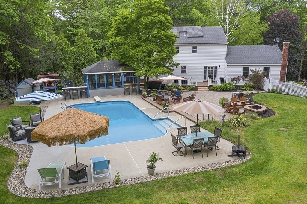 237 Hollis Road Lunenburg, MA 01462 - Photo 38 of 42 a view of a patio with table and chairs potted plants and swimming pool