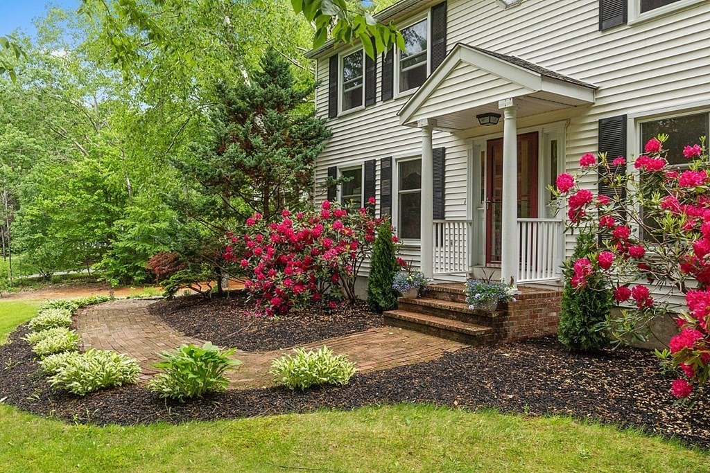 237 Hollis Road Lunenburg, MA 01462 - Photo 4 of 42 a view of a house with a yard and garden