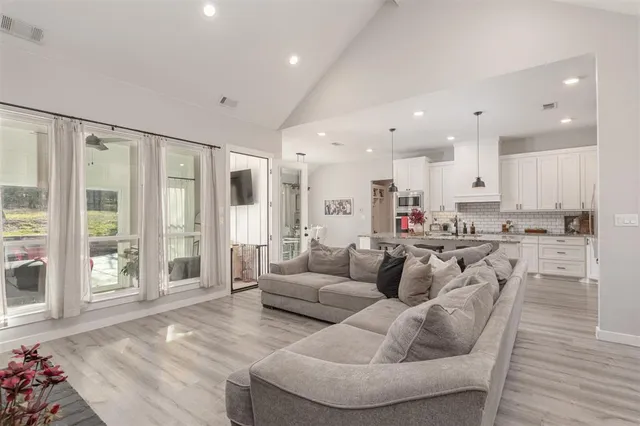 a bathroom with a granite countertop sink mirror and vanity