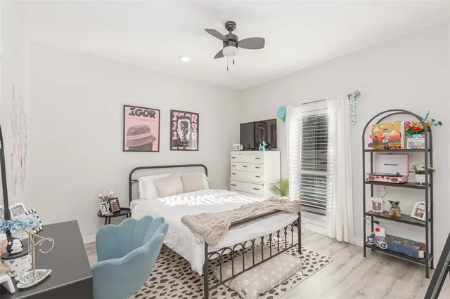 a bedroom with a bed and a table