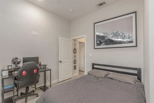 a bathroom with a granite countertop sink a mirror and a shower