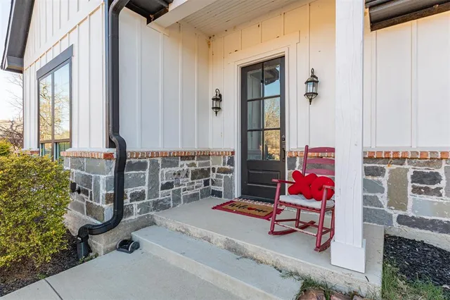 a view of a hallway and an dresser in a room