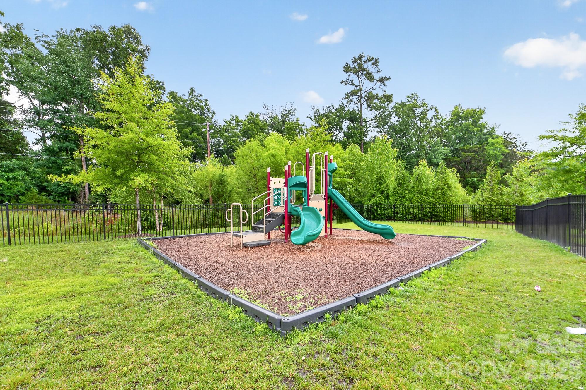 5972 Redwood Pine Road Concord, NC 28027 - Photo 36 of 37 a view of a backyard with a trampoline