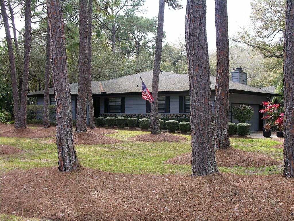 4443 Lost Forest Road Sarasota, FL 34235 - Photo 1 of 1 a front view of a house with garden