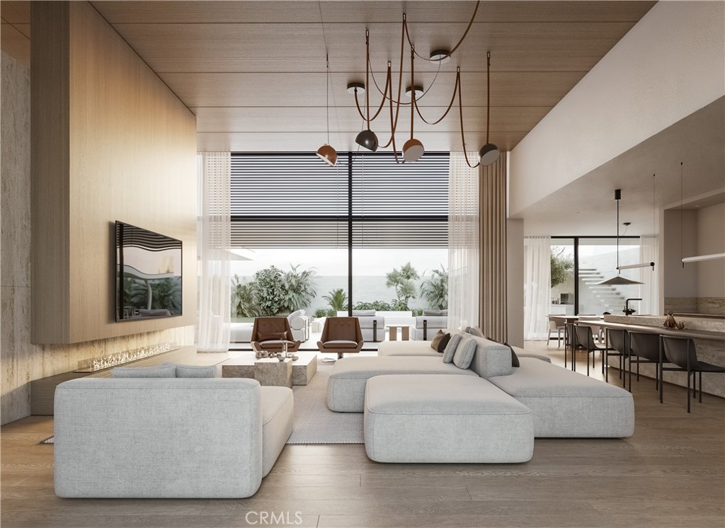 4601 Hampden Road Corona del Mar, CA 92625 - Photo 1 of 1 a living room with couches and a large window with garden view