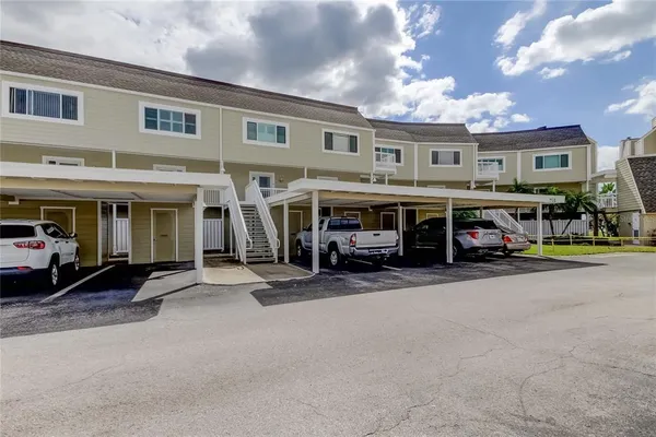 a view of a building with car parked