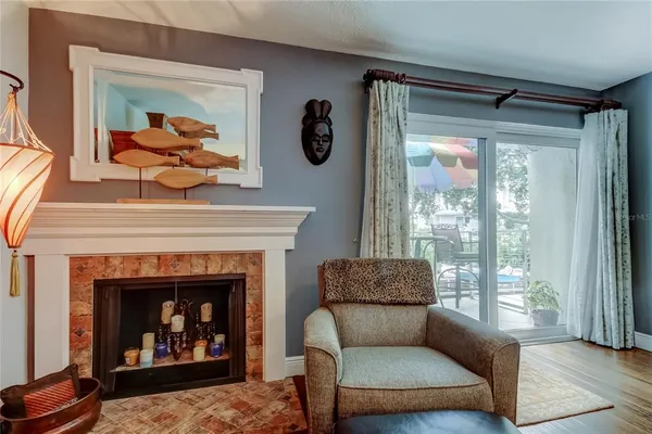 a view of a livingroom with wooden floor and a flat screen tv