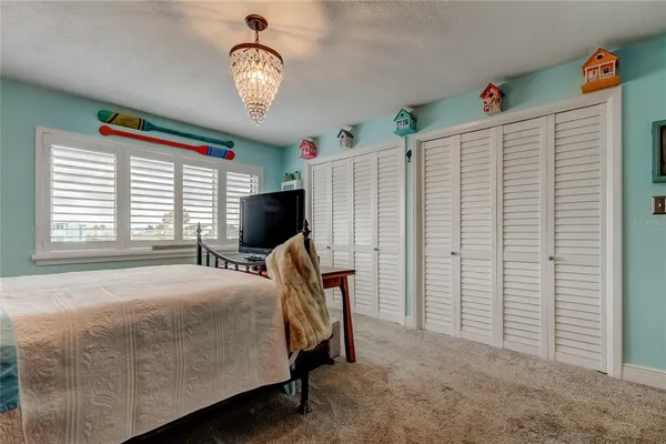 a bed room with a bed and a desk
