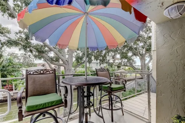 a view of a chairs and table in patio