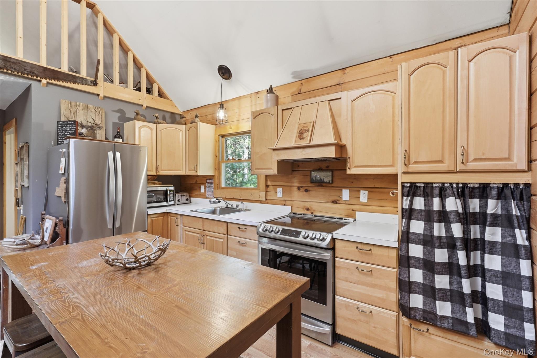 301 Pucky Huddle Road Bethel, NY 12720 - Photo 12 of 39 Practical kitchen with open layout and eat in setup.