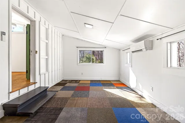 a view of a porch with wooden floor