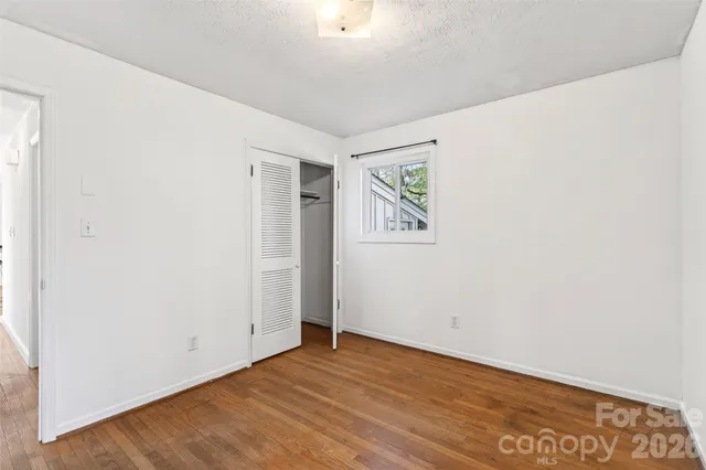 a front view of a house with a yard and porch