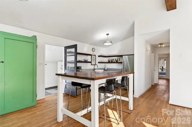 a bedroom with a bed and a wall painting