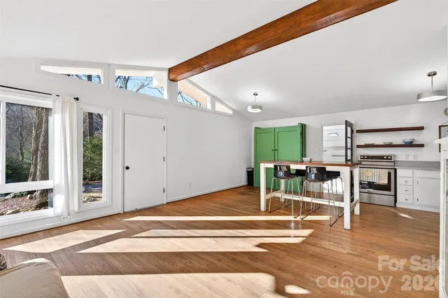 an empty room with wooden floor