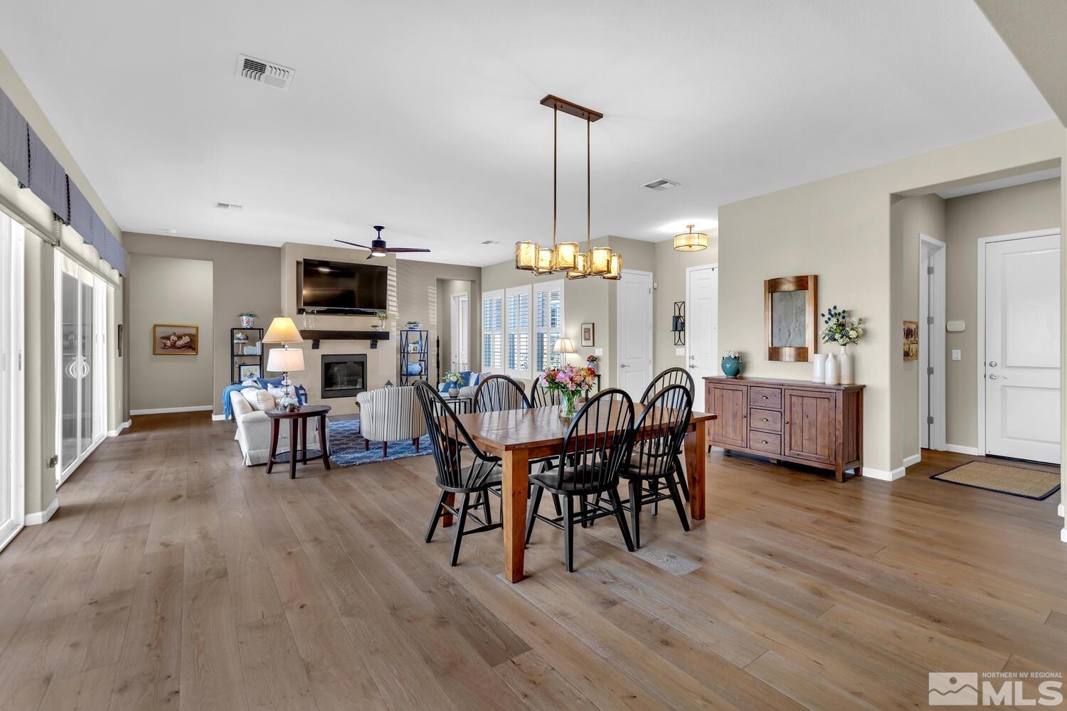 9775 Thesolious Lane Reno, NV 89521 - Photo 14 of 40 a dining room with furniture and wooden floor