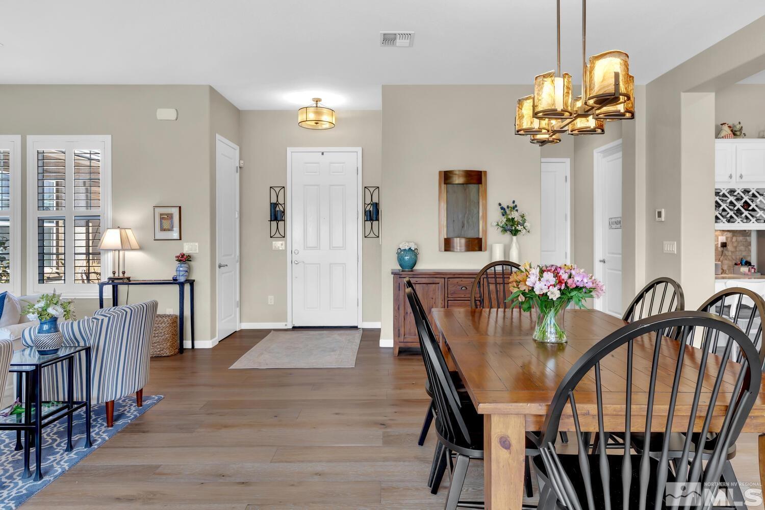 9775 Thesolious Lane Reno, NV 89521 - Photo 19 of 40 a view of a dining room with furniture and chandelier