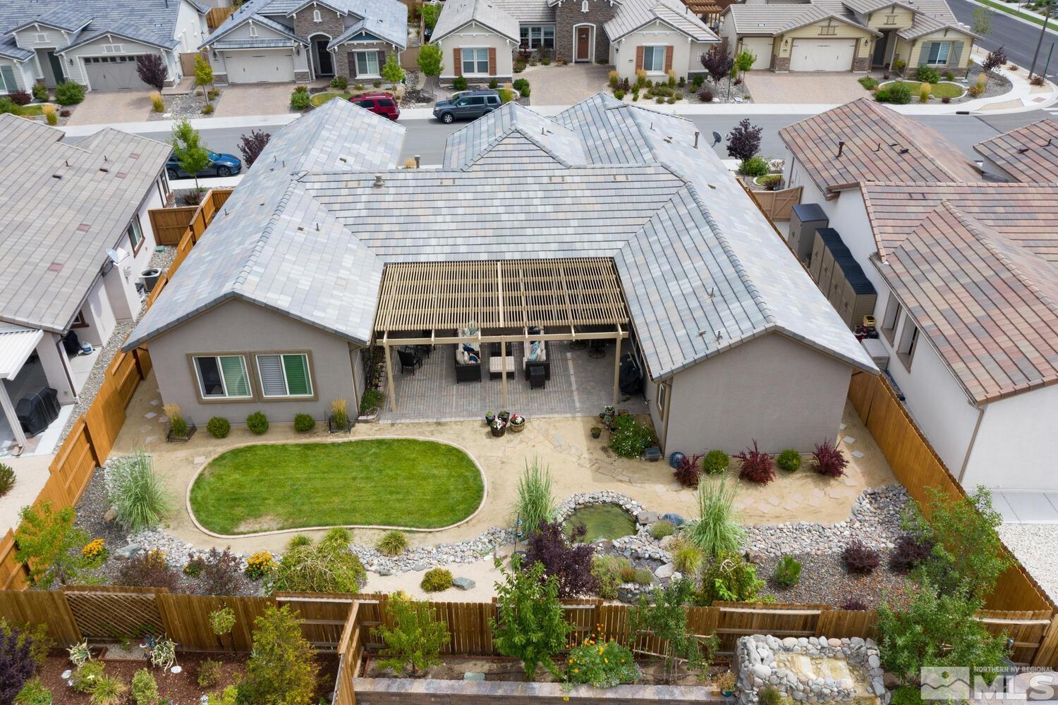 9775 Thesolious Lane Reno, NV 89521 - Photo 2 of 40 an aerial view of residential house with outdoor space swimming pool and seating