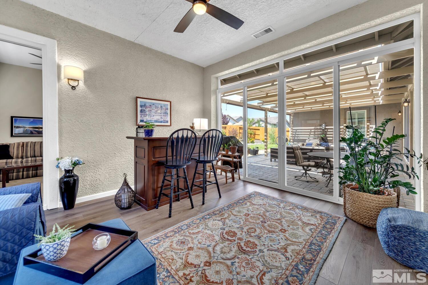 9775 Thesolious Lane Reno, NV 89521 - Photo 21 of 40 a living room with furniture and a potted plant