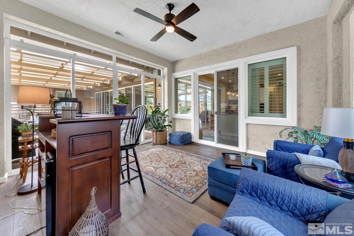 9775 Thesolious Lane Reno, NV 89521 - Photo 22 of 40 a living room with furniture and a large window