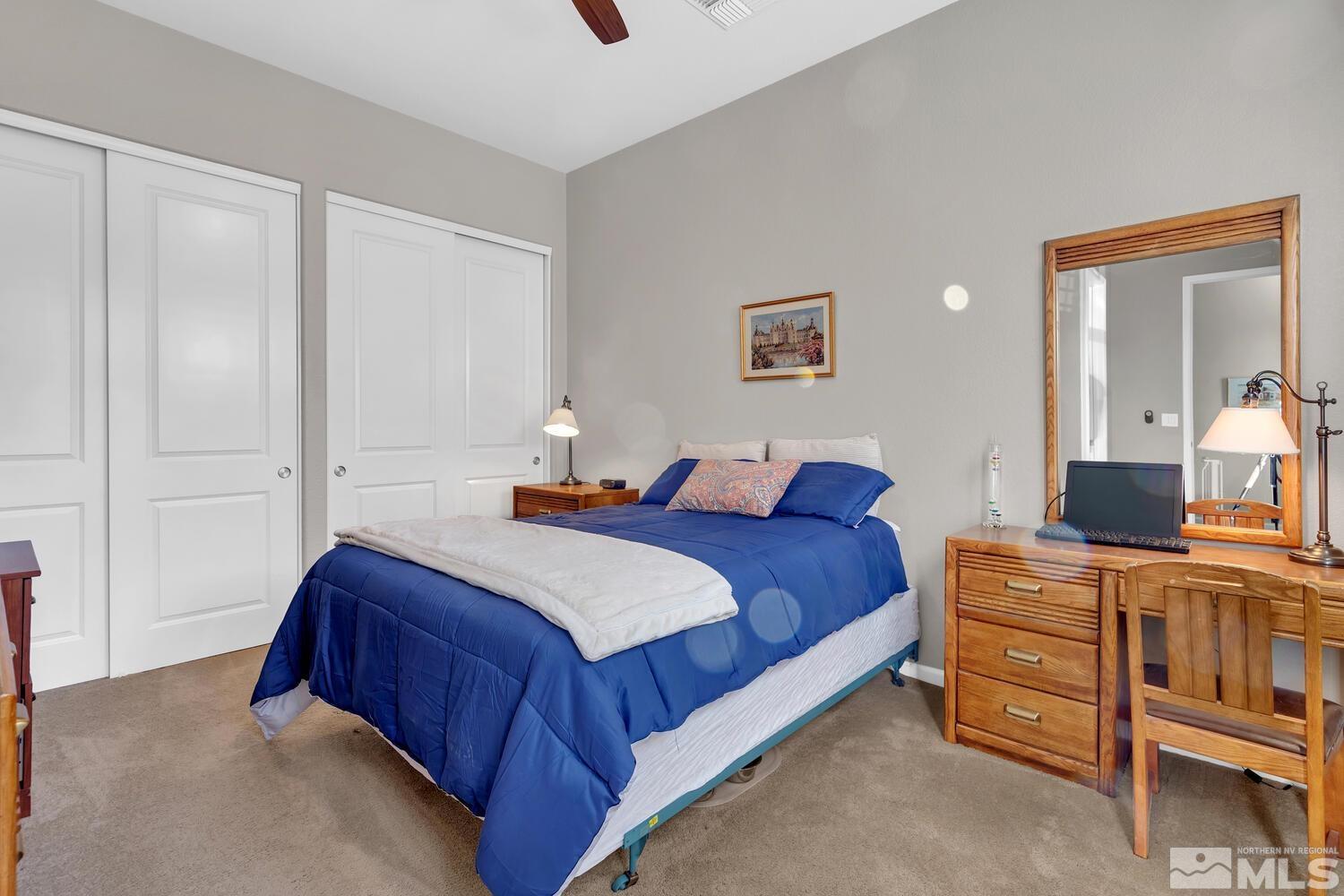 9775 Thesolious Lane Reno, NV 89521 - Photo 25 of 40 a bedroom with a bed and a cabinets