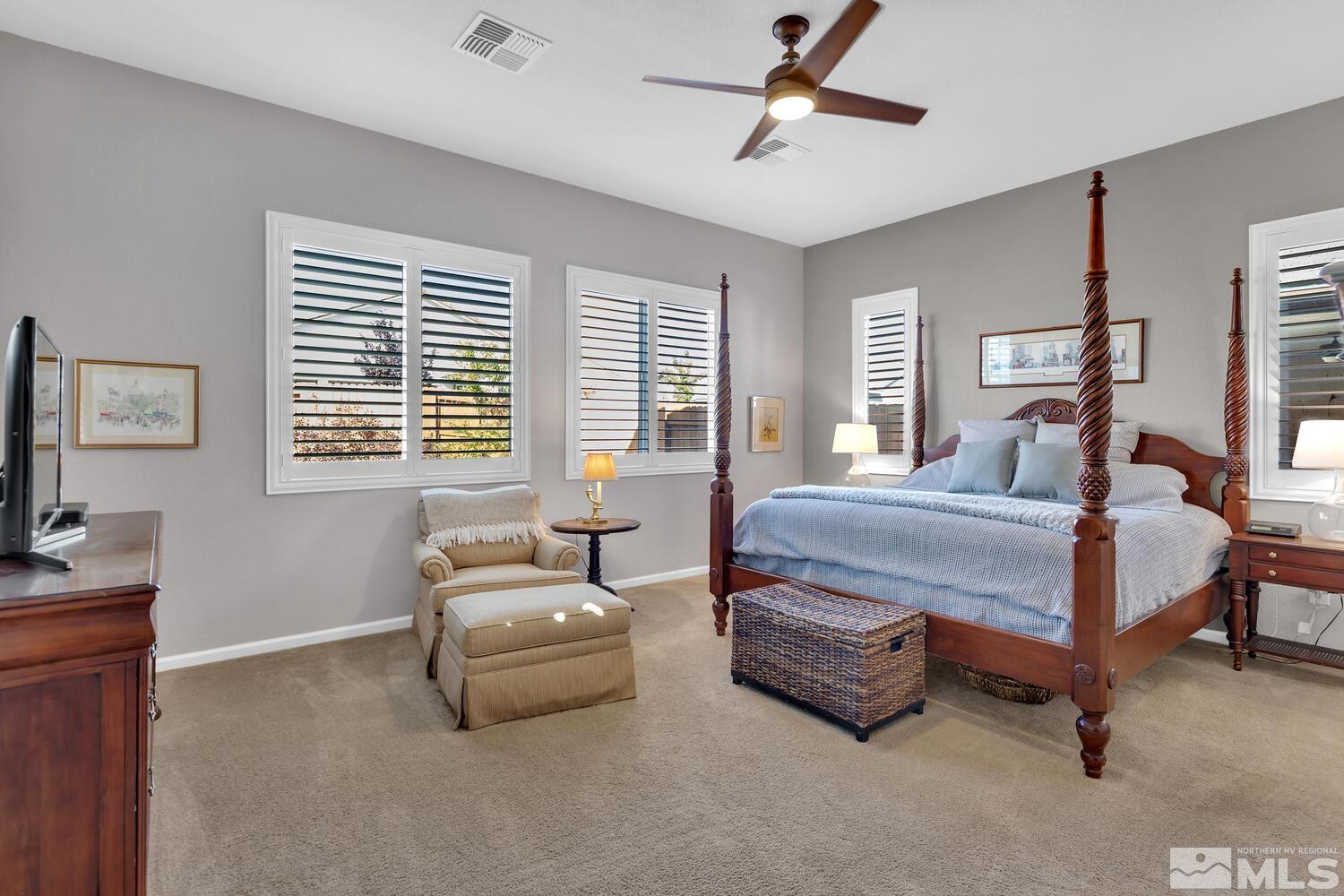 9775 Thesolious Lane Reno, NV 89521 - Photo 28 of 40 a bedroom with a bed and a couch