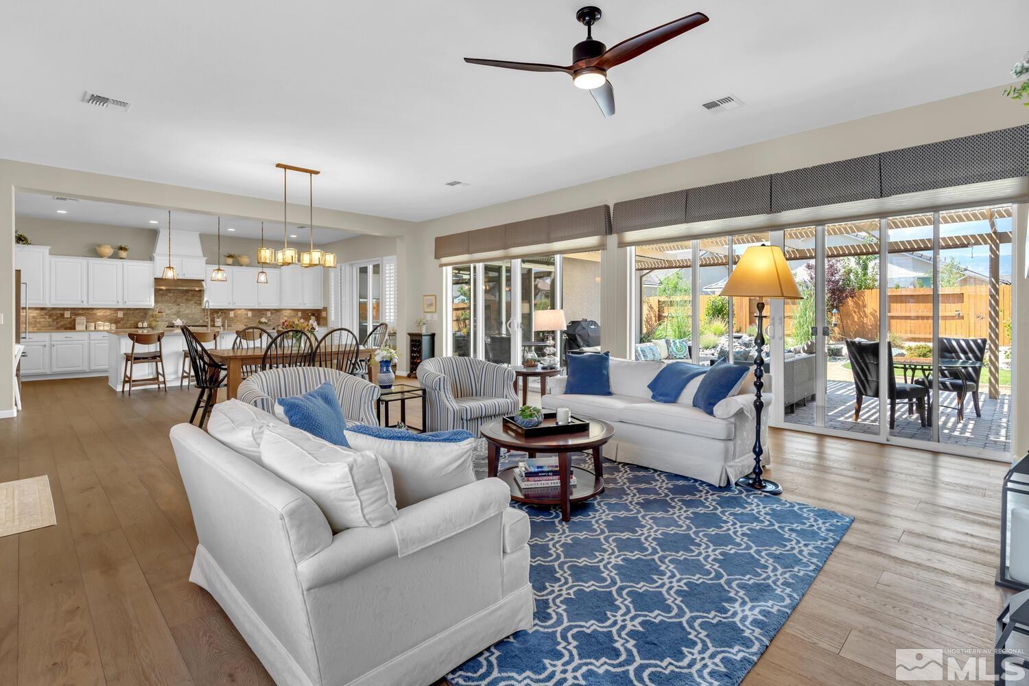 9775 Thesolious Lane Reno, NV 89521 - Photo 3 of 40 a living room with furniture and a large window
