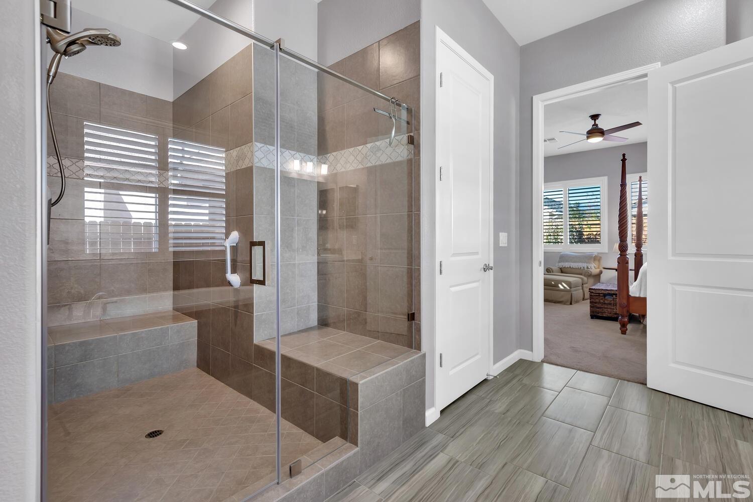 9775 Thesolious Lane Reno, NV 89521 - Photo 32 of 40 a bathroom with a shower and a sink