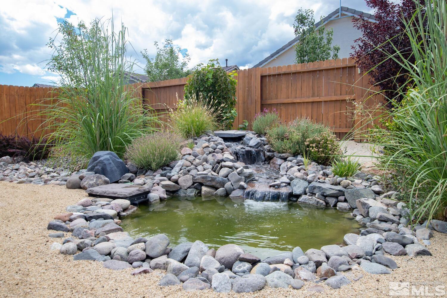 9775 Thesolious Lane Reno, NV 89521 - Photo 33 of 40 a view of a house with a yard bath tub and trees around