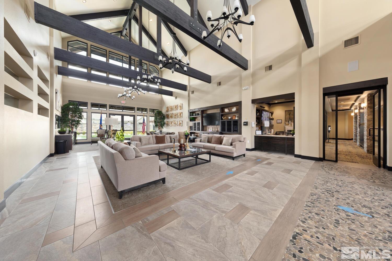 9775 Thesolious Lane Reno, NV 89521 - Photo 35 of 40 a living room with furniture and a chandelier