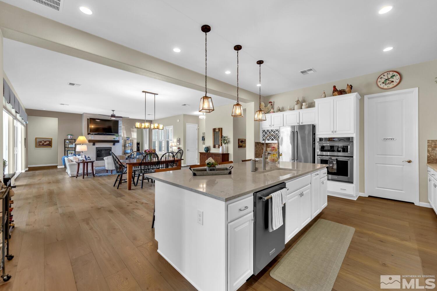 9775 Thesolious Lane Reno, NV 89521 - Photo 10 of 40 a kitchen with stainless steel appliances granite countertop a stove oven and a refrigerator