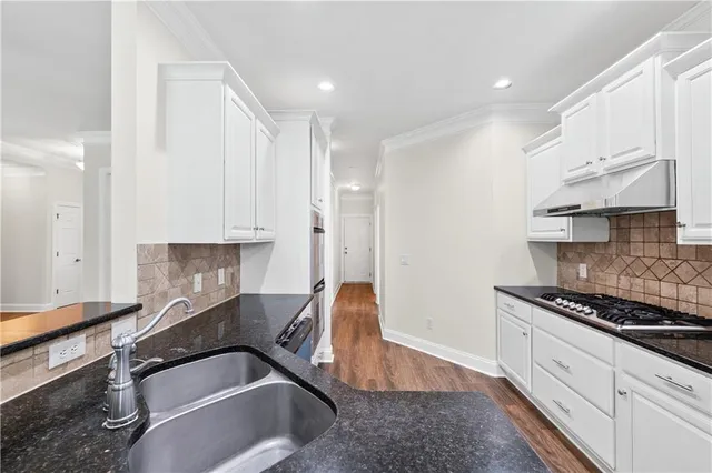 a kitchen that has a lot of cabinets in it