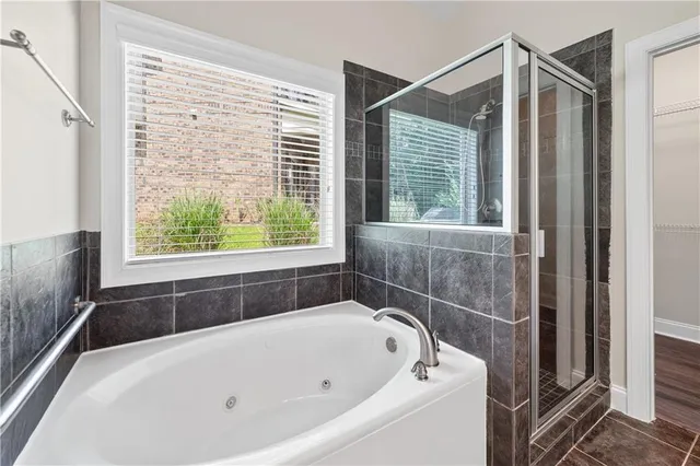 a bathroom with a bathtub and window