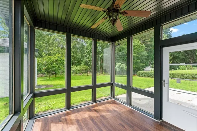 a view of porch with a large tree