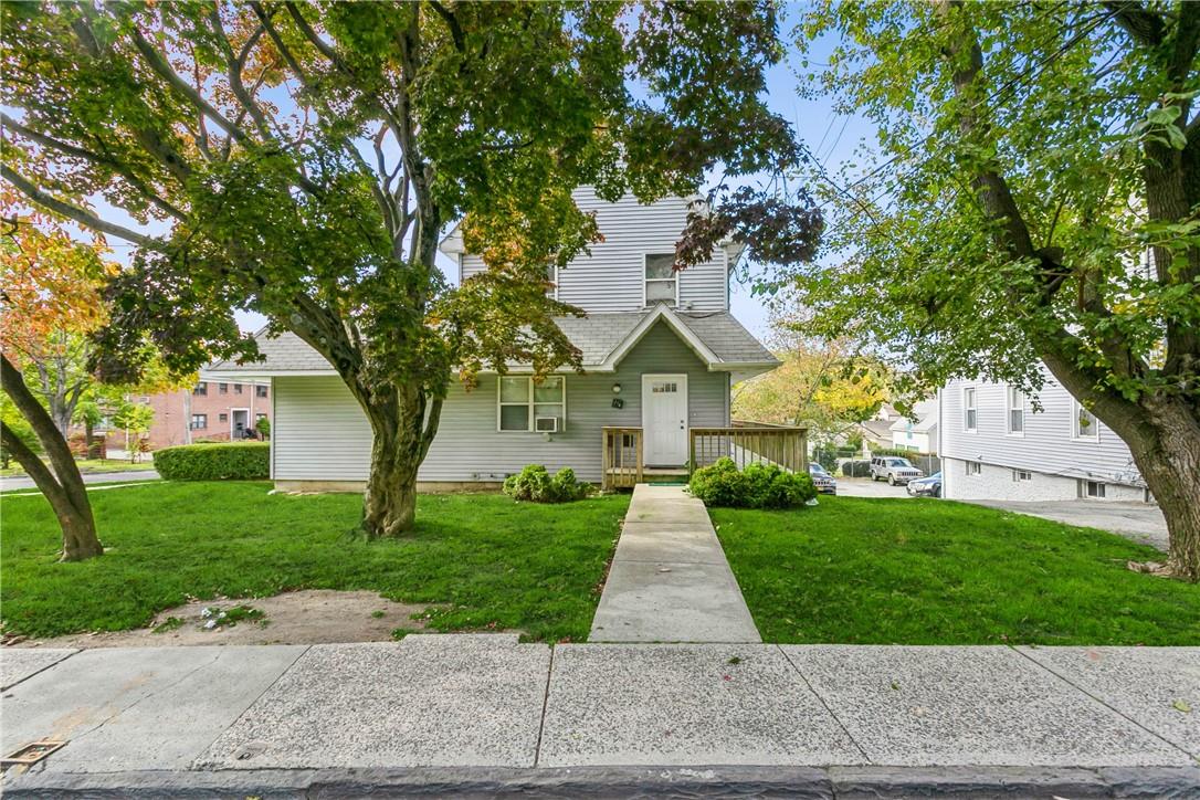 a front view of a house with yard