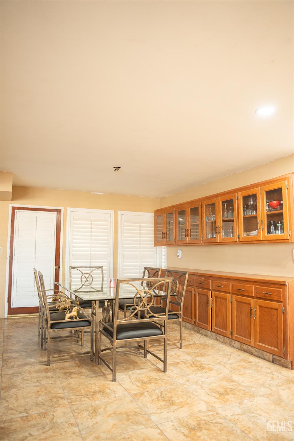 Undisclosed Address Bakersfield, CA 93308 - Photo 19 of 29 a view of a living room a dining room with furniture