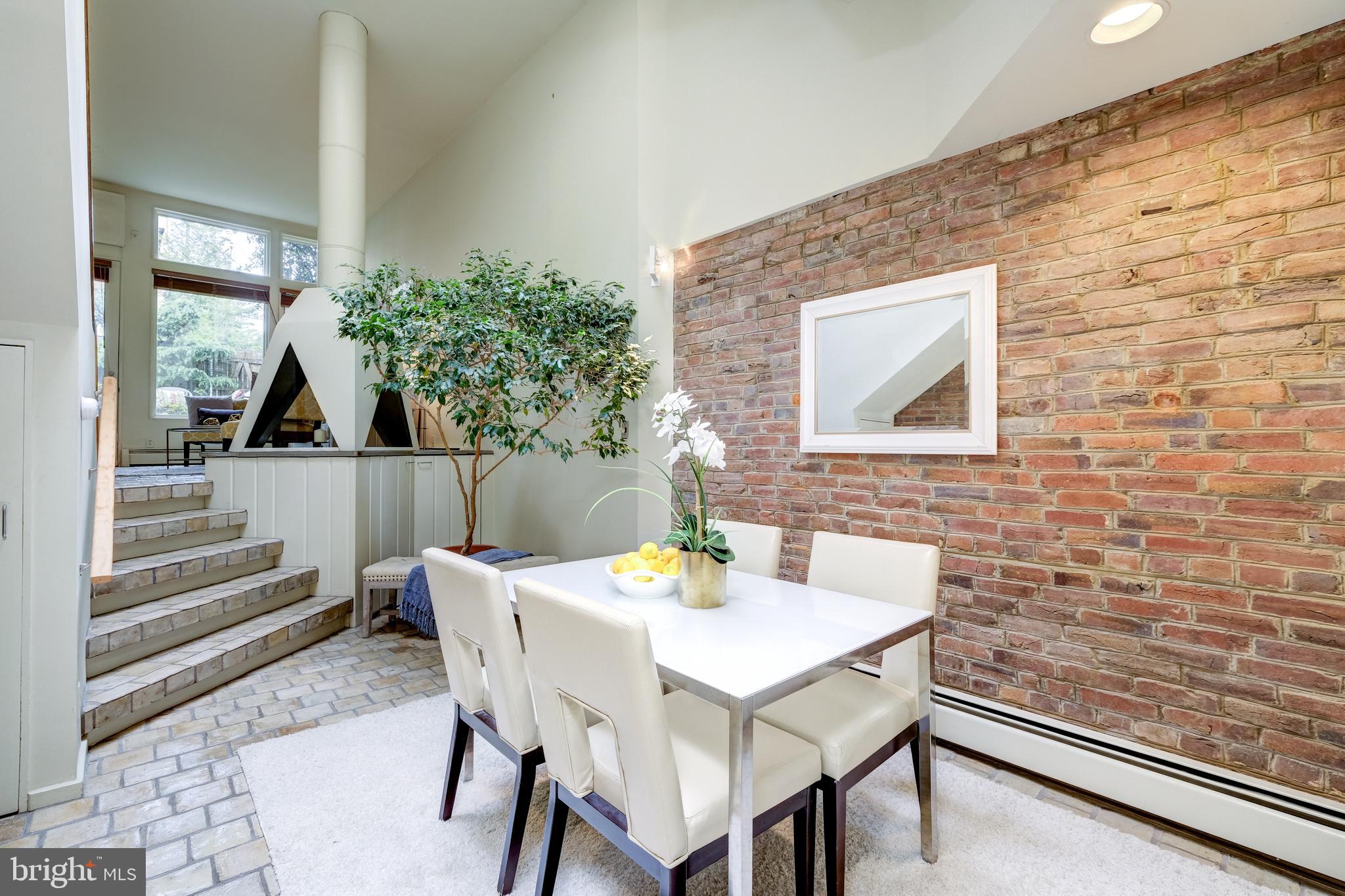 2415 I Street Northwest Washington, DC 20037 - Photo 10 of 28 Dining room with brick wall