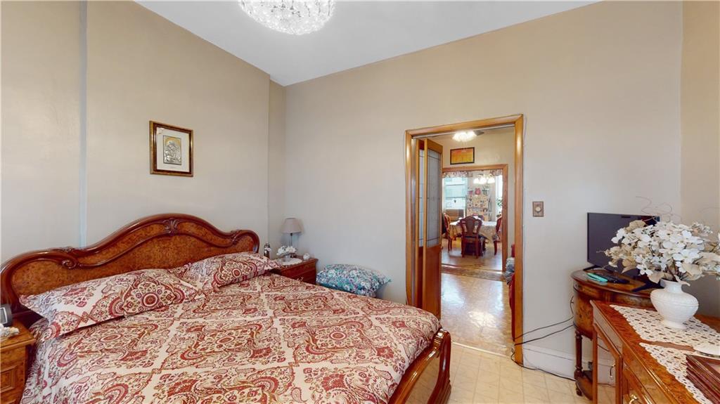 29 3rd Place Brooklyn, NY 11231 - Photo 11 of 25 a bedroom with a bed and wooden floor