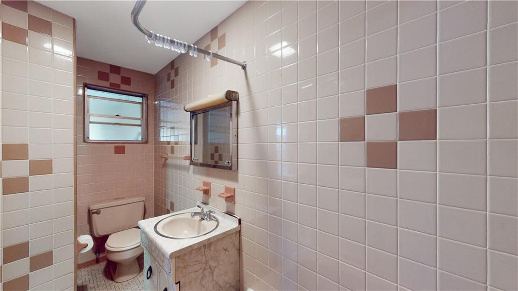 29 3rd Place Brooklyn, NY 11231 - Photo 22 of 25 a bathroom with a toilet a sink and mirror