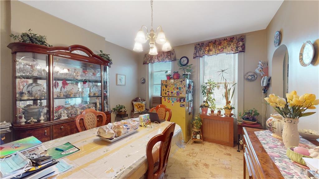 29 3rd Place Brooklyn, NY 11231 - Photo 5 of 25 a bedroom with furniture and a chandelier