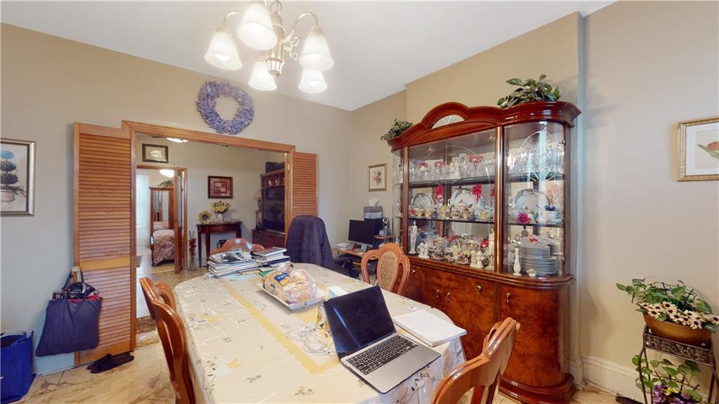 29 3rd Place Brooklyn, NY 11231 - Photo 6 of 25 a view of a dining room with furniture a chandelier and wooden floor